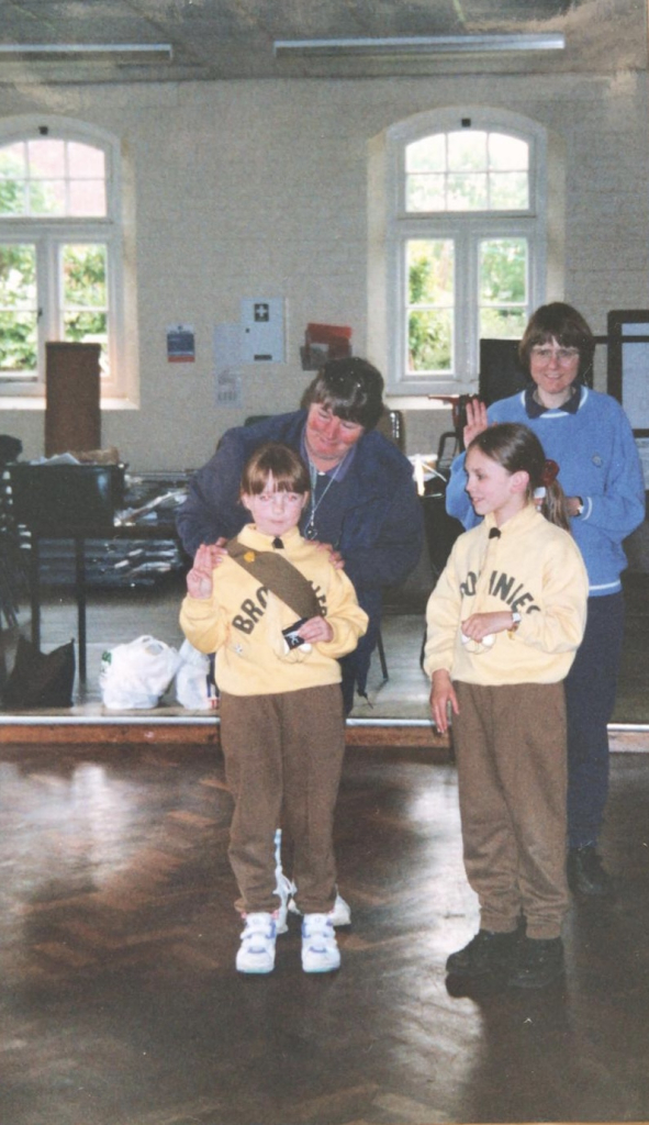 Brogan as a Brownie in 2001, making her Girlguiding promise